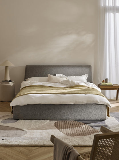 Clovarde Upholstered Bed in Bouclé